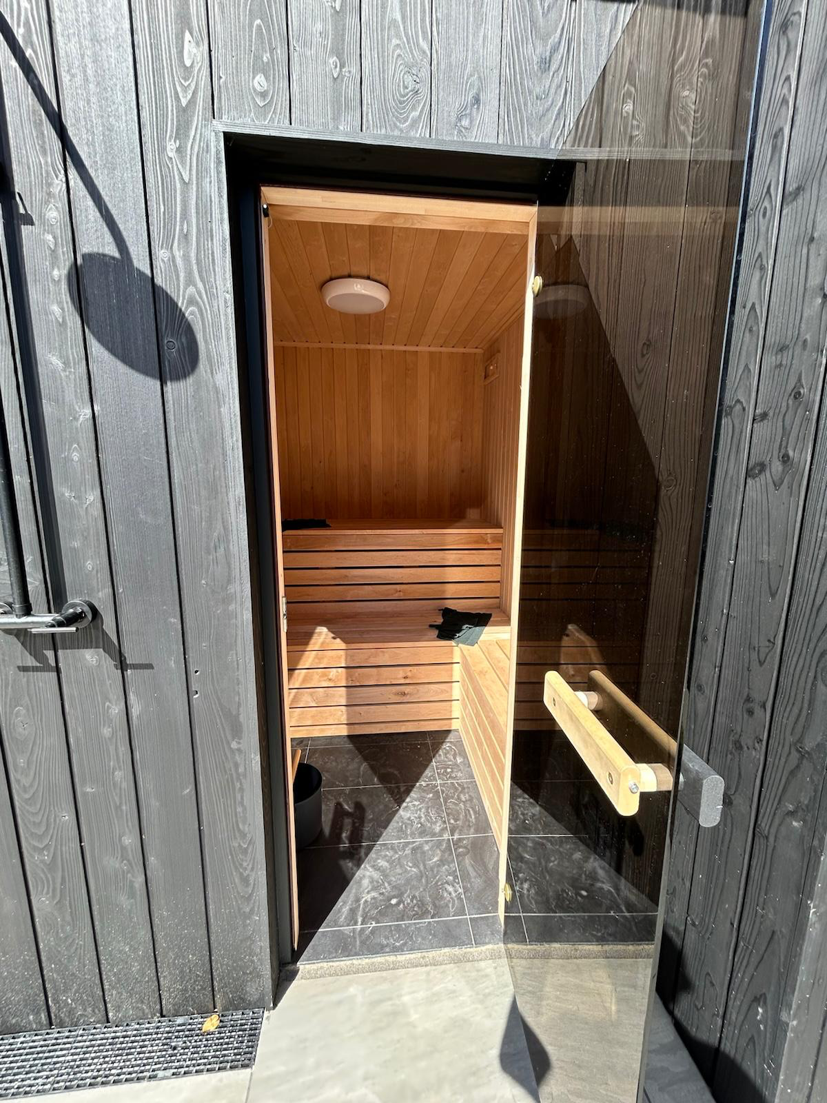 Charred larch garden room with integrated sauna door, Dublin