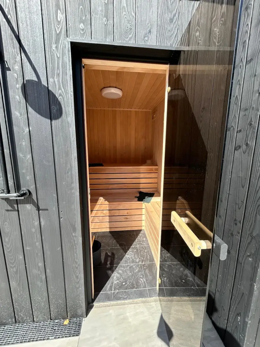 Charred larch garden room with integrated sauna door, Dublin