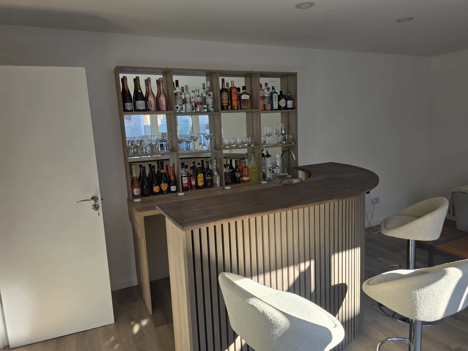 Bar unit from side angle showing shelving and counter
