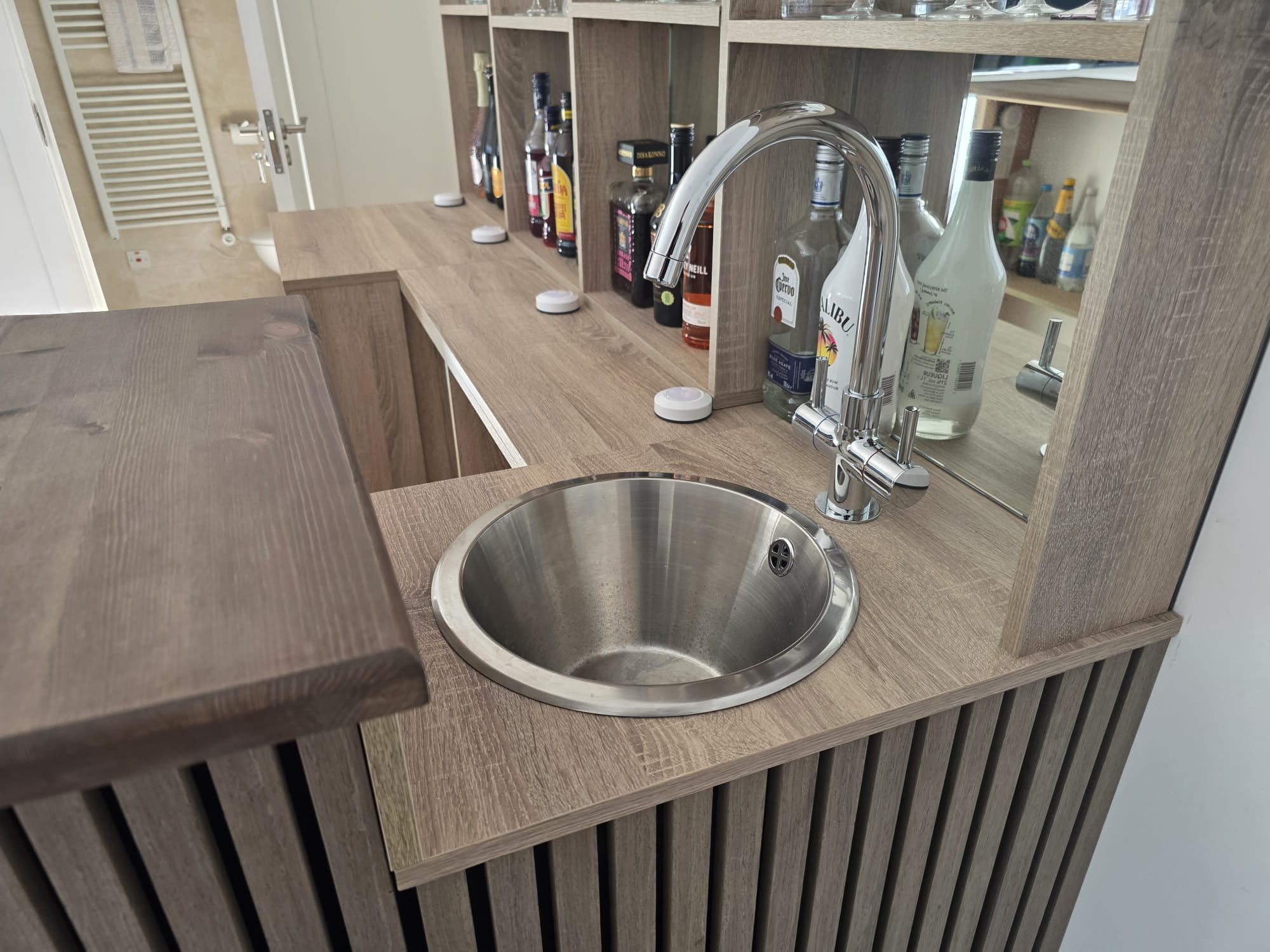 Bar counter detail with round stainless steel sink