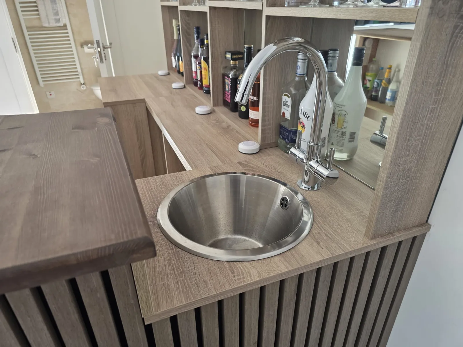 Bar counter detail with round stainless steel sink