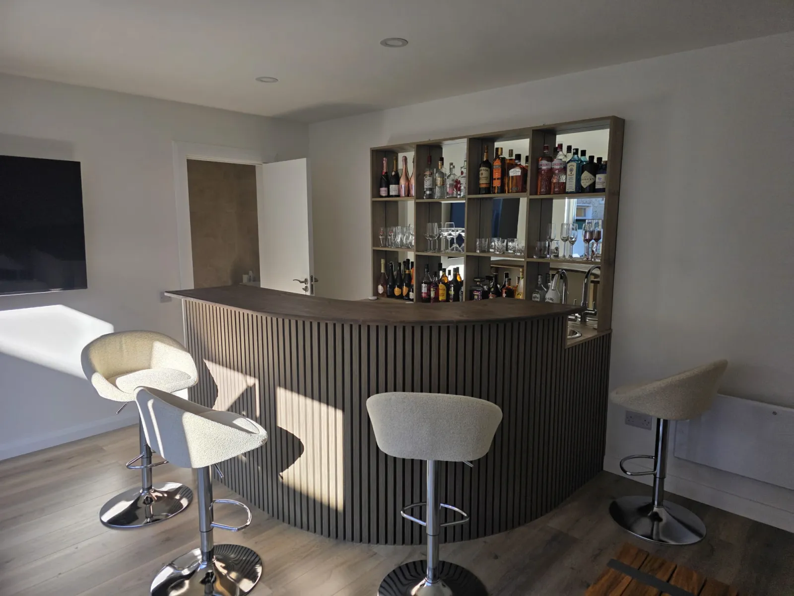 Full bar with curved slatted front and bar stools, garden lounge Dublin