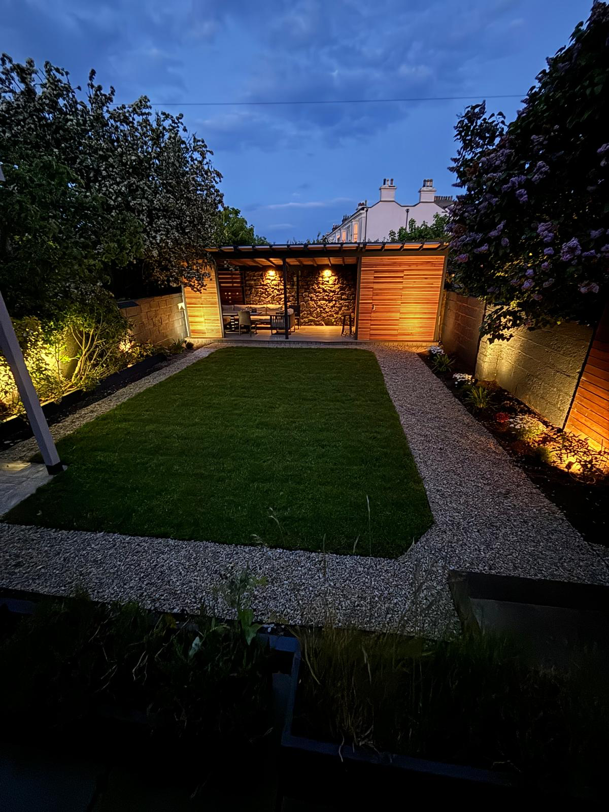 Night time — cedar pergola and garden illuminated, Co. Dublin