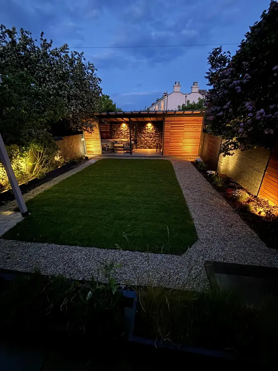 Night time — cedar pergola and garden illuminated, Co. Dublin