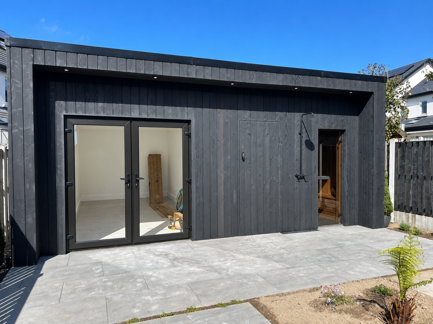 Black timber garden room with patio Dublin