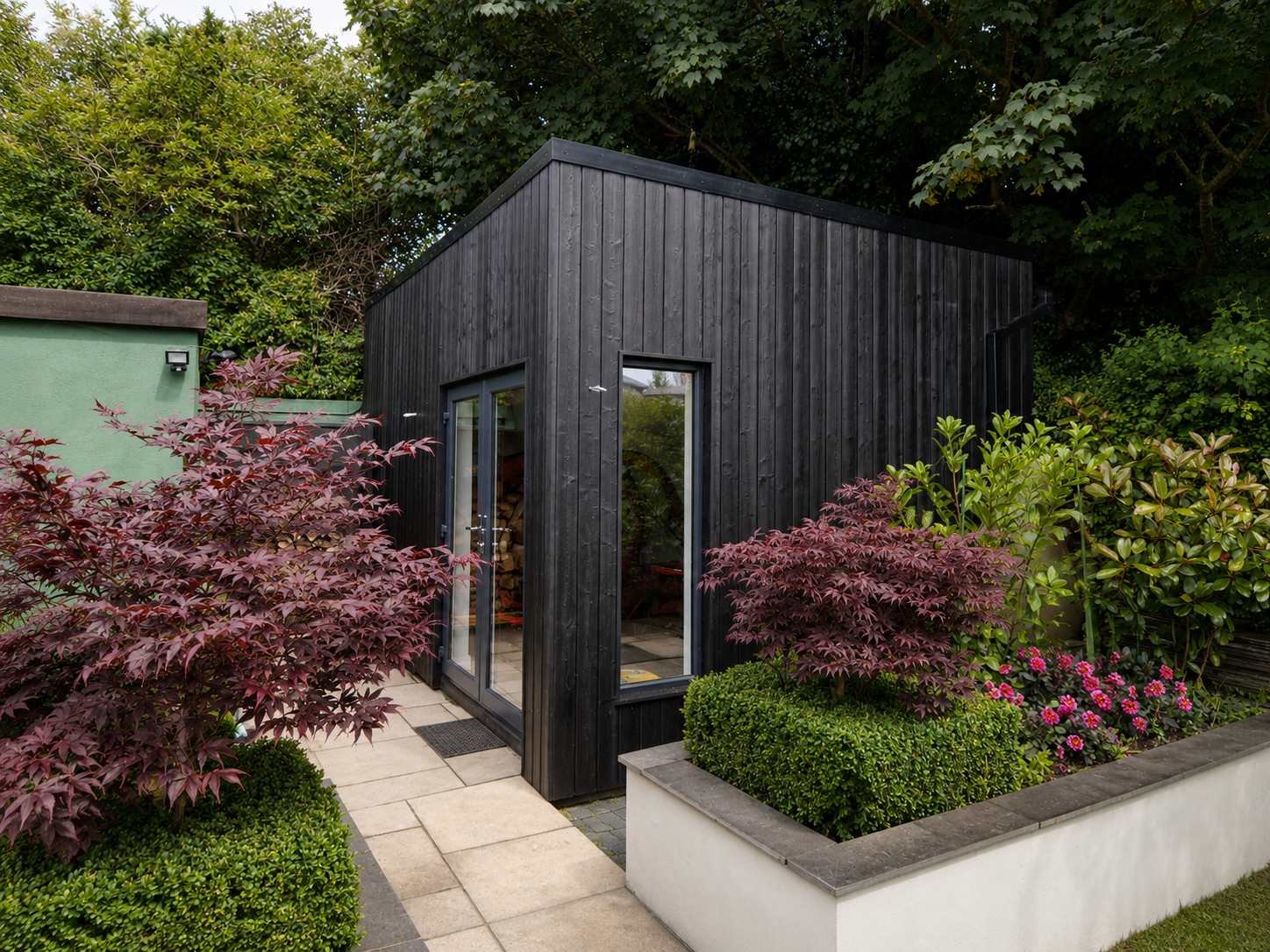 Black timber garden room with Japanese maples Dublin