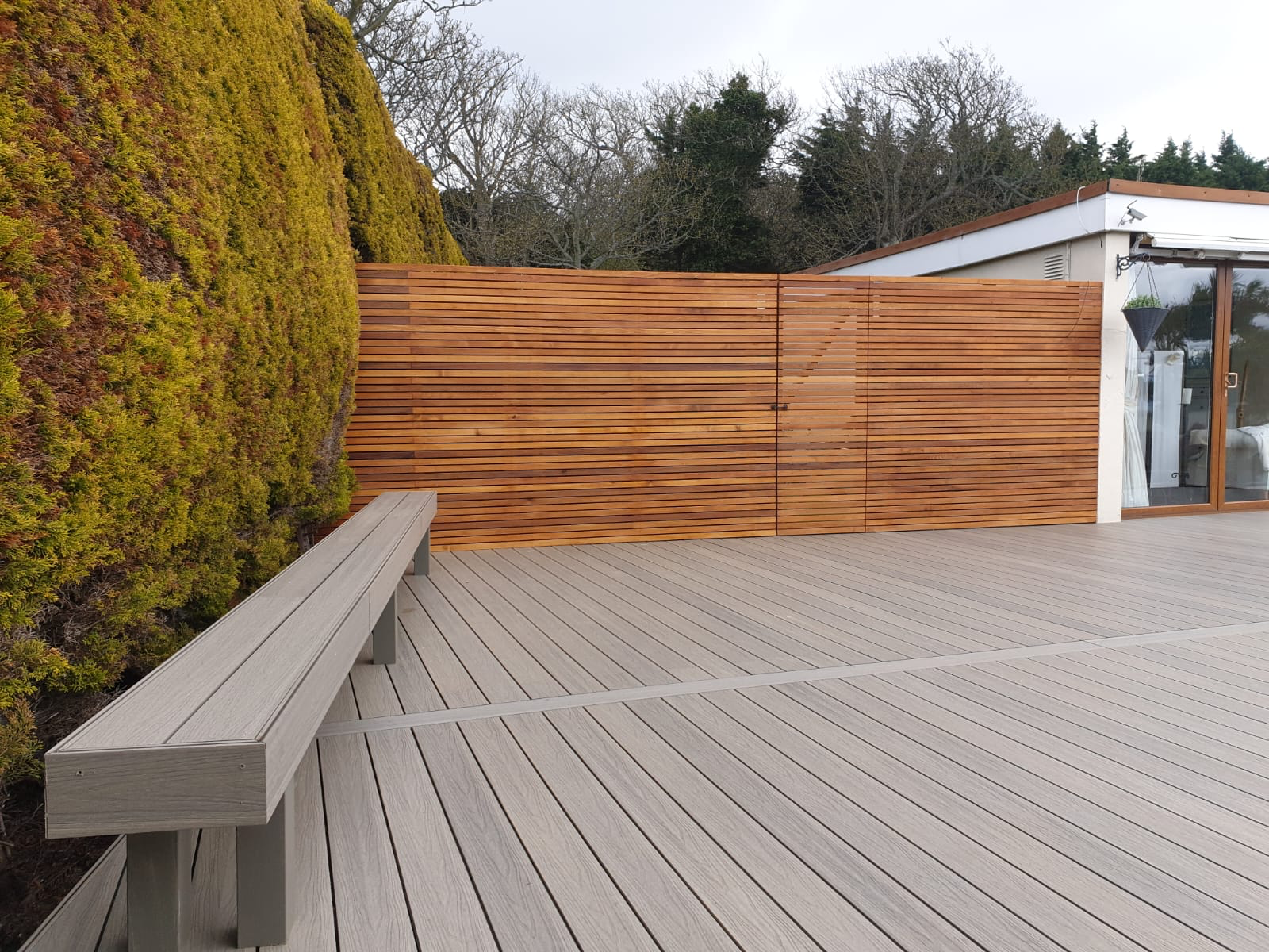 Composite decking with cedar privacy fencing Dublin