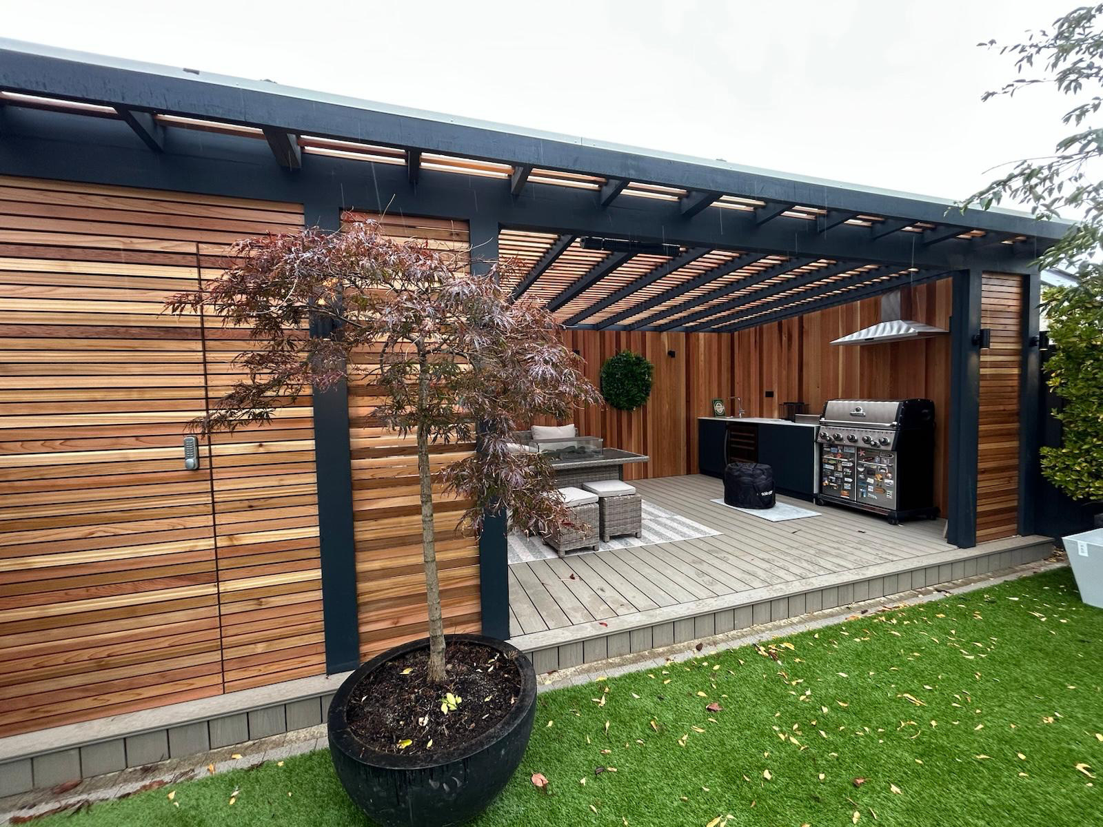 Steel pergola with cedar screening and outdoor kitchen Kildare