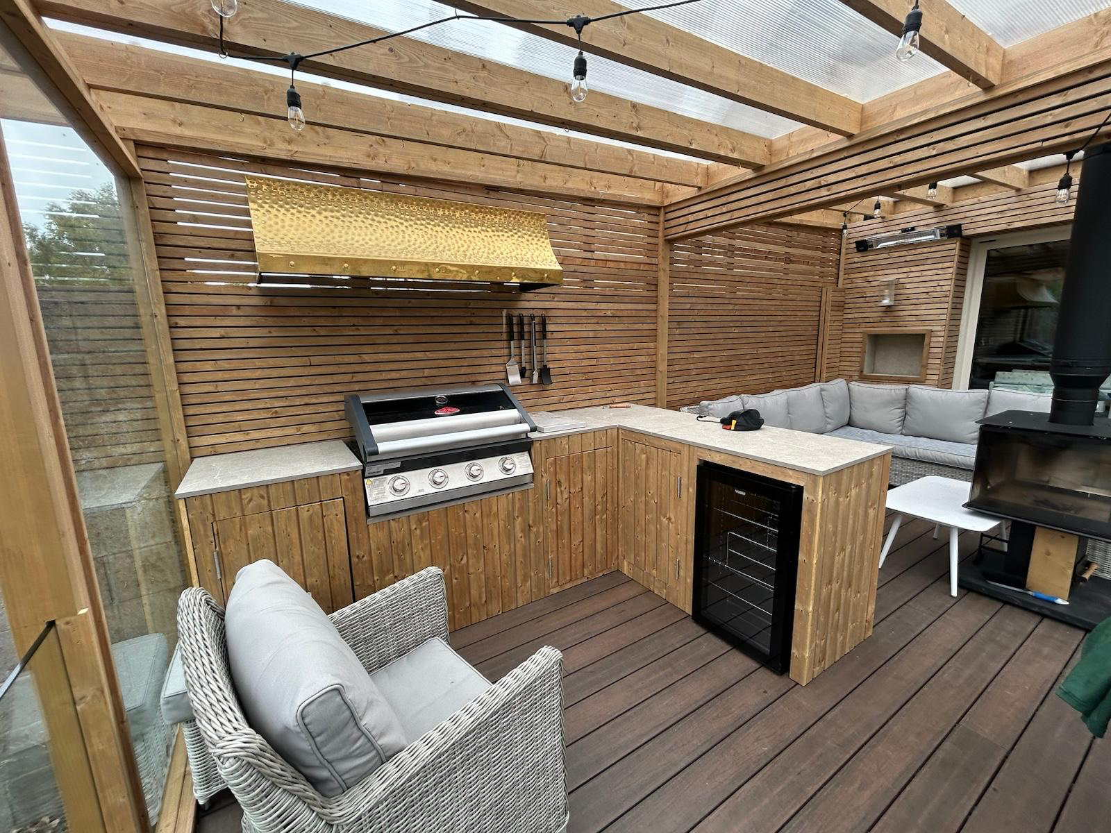 Timber pergola with polycarbonate roof and outdoor kitchen Dublin