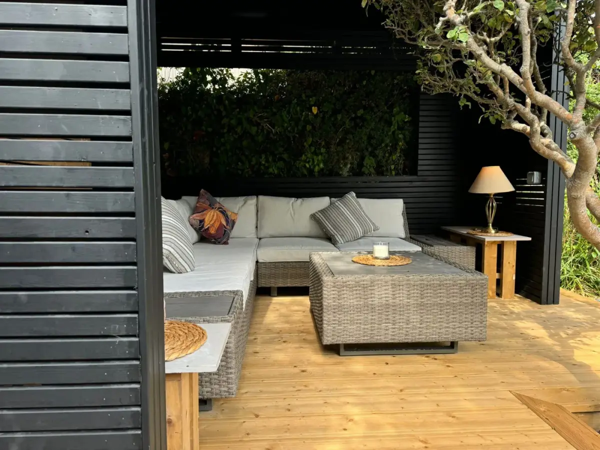 Black timber pergola with lounge seating and decking Dublin